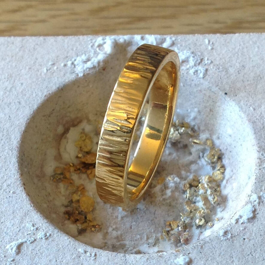 The Eogan ring in rare Welsh Gold with a decorative hammered finish