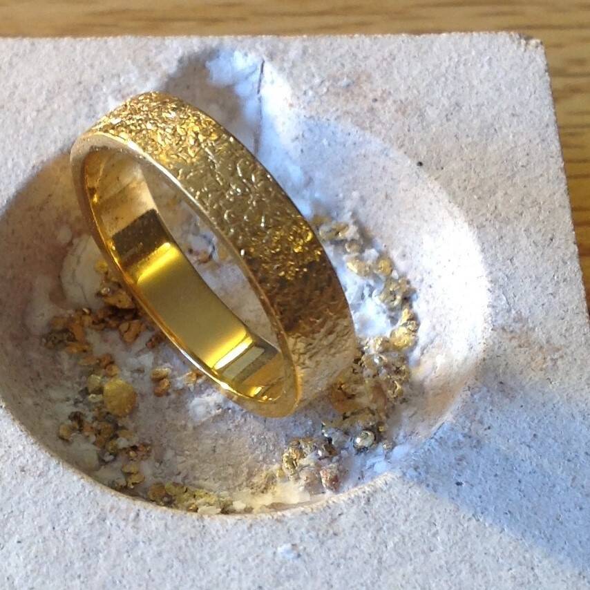 The Avalon ring in rare Welsh Gold with a decorative hammered finish