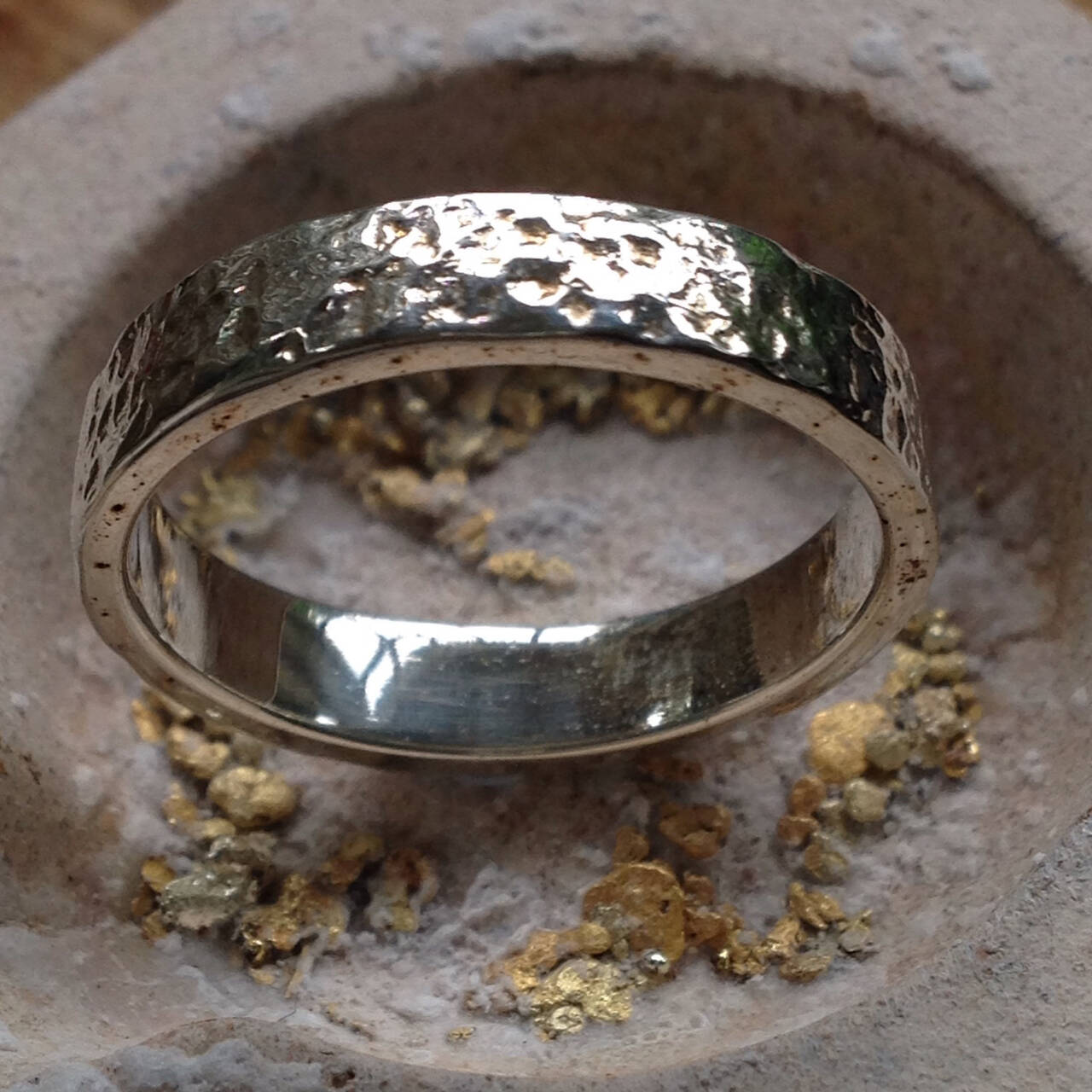 The Cynbel ring in rare Welsh Gold with a distinctive hammered finish