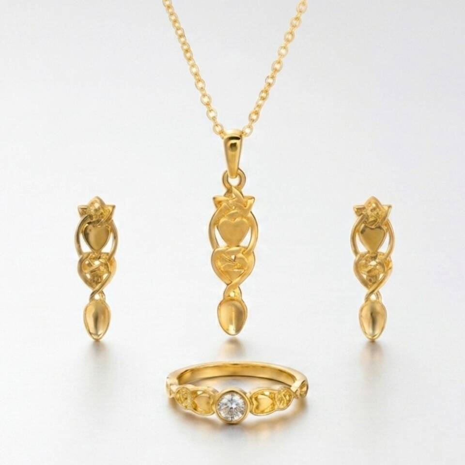 An image of the full collection of Lovespoon jewellery on a white background showing a pendant, earrings and diamond ring